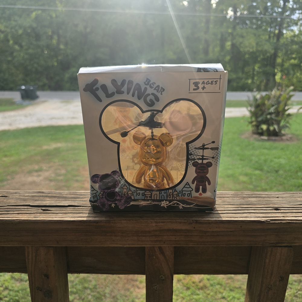 Flying Bear Toy with Gold and Purple Accents